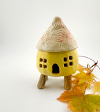Little Spirit Stilt House 01. Satin yellow variant.